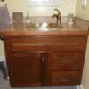 Flat panel glazed cherry vanity; laminate top with wood edging